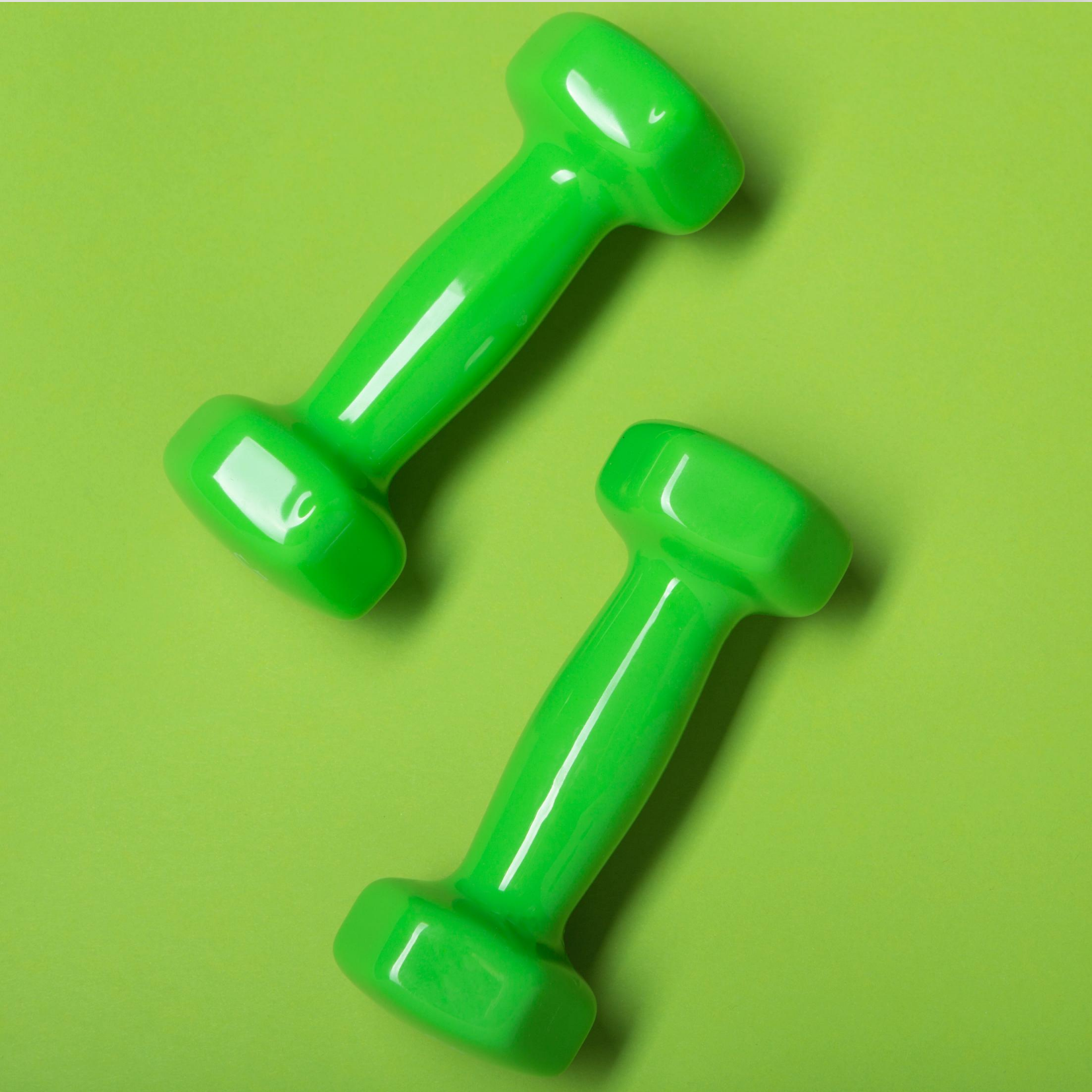 Green Hand Weights depicting Sports Nutrition