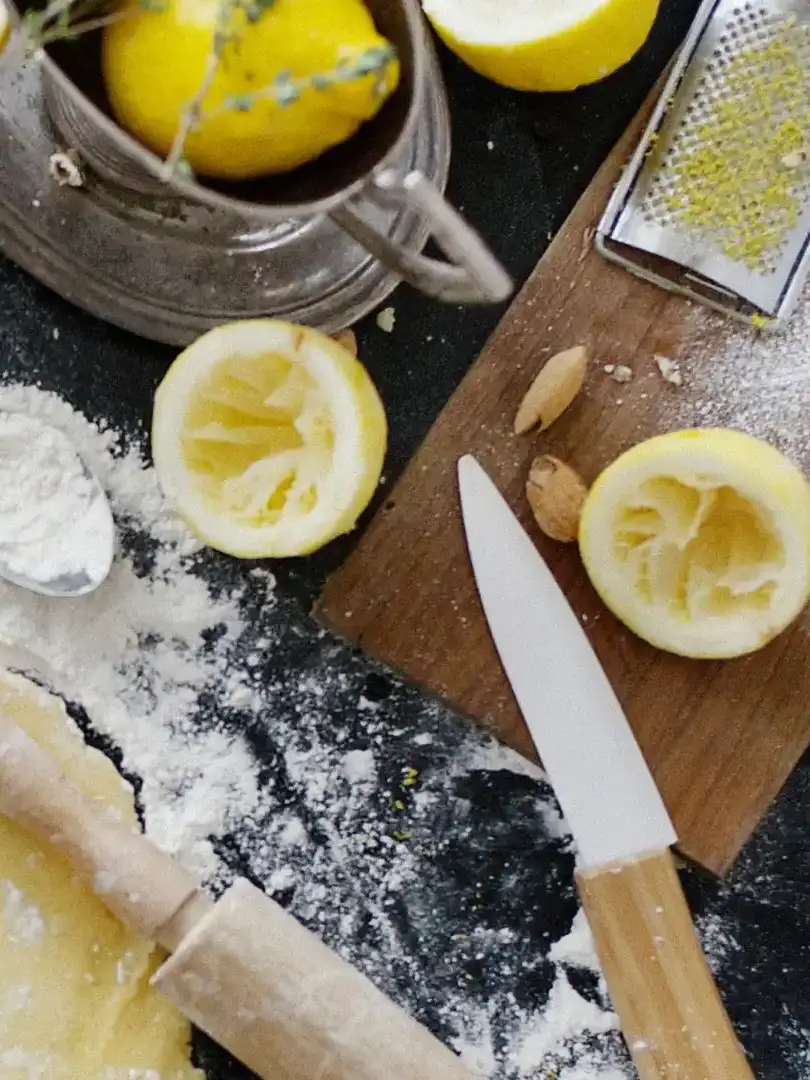 Cooking station with knife, lemons, cutting board depicting Meal Services